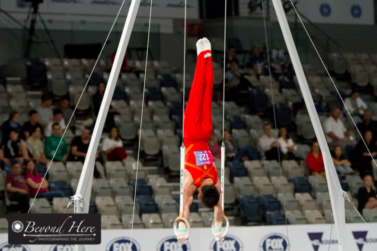 Male gymnast doing rings